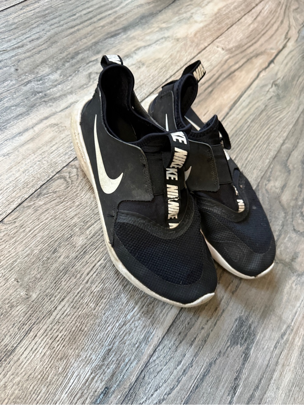 Nike Men’s Black and White Slip-On Athletic Sneakers